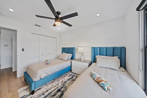 a bedroom with a bed and a dresser