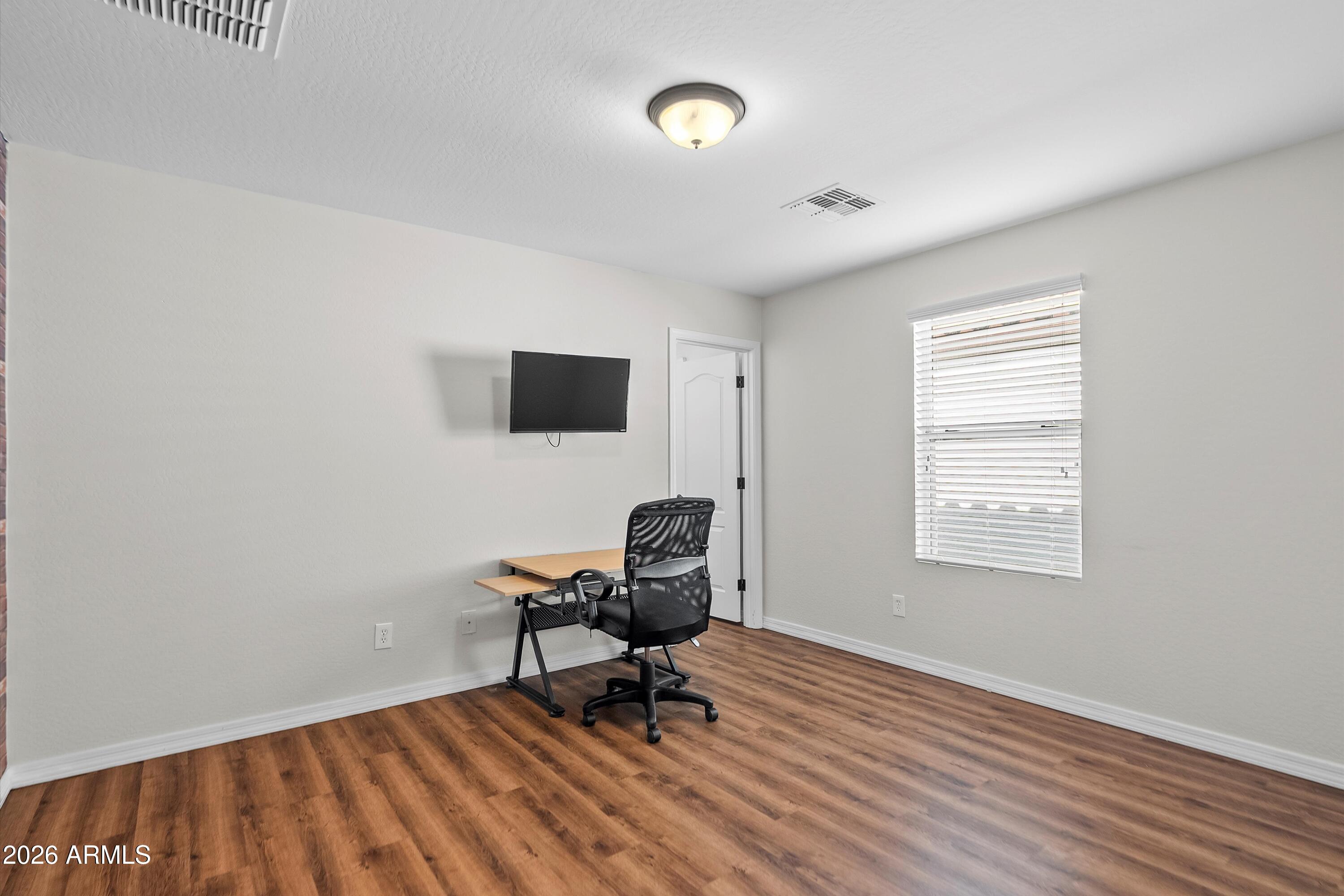 955 South Henry Lane Gilbert, AZ 85296 - Photo 25 of 40 a workspace with wooden floor and a window