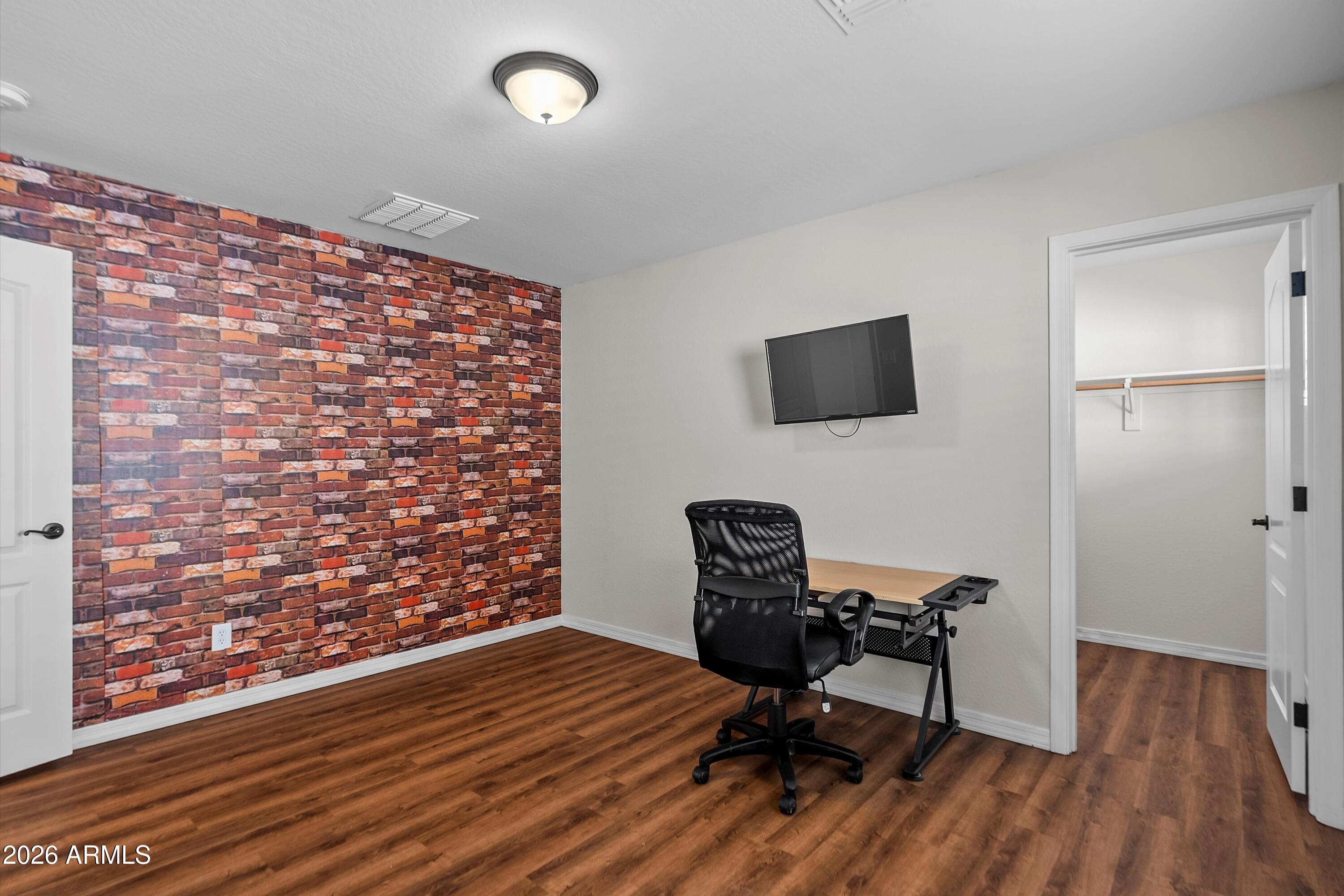 955 South Henry Lane Gilbert, AZ 85296 - Photo 26 of 40 a view of a workspace with furniture and wooden floor
