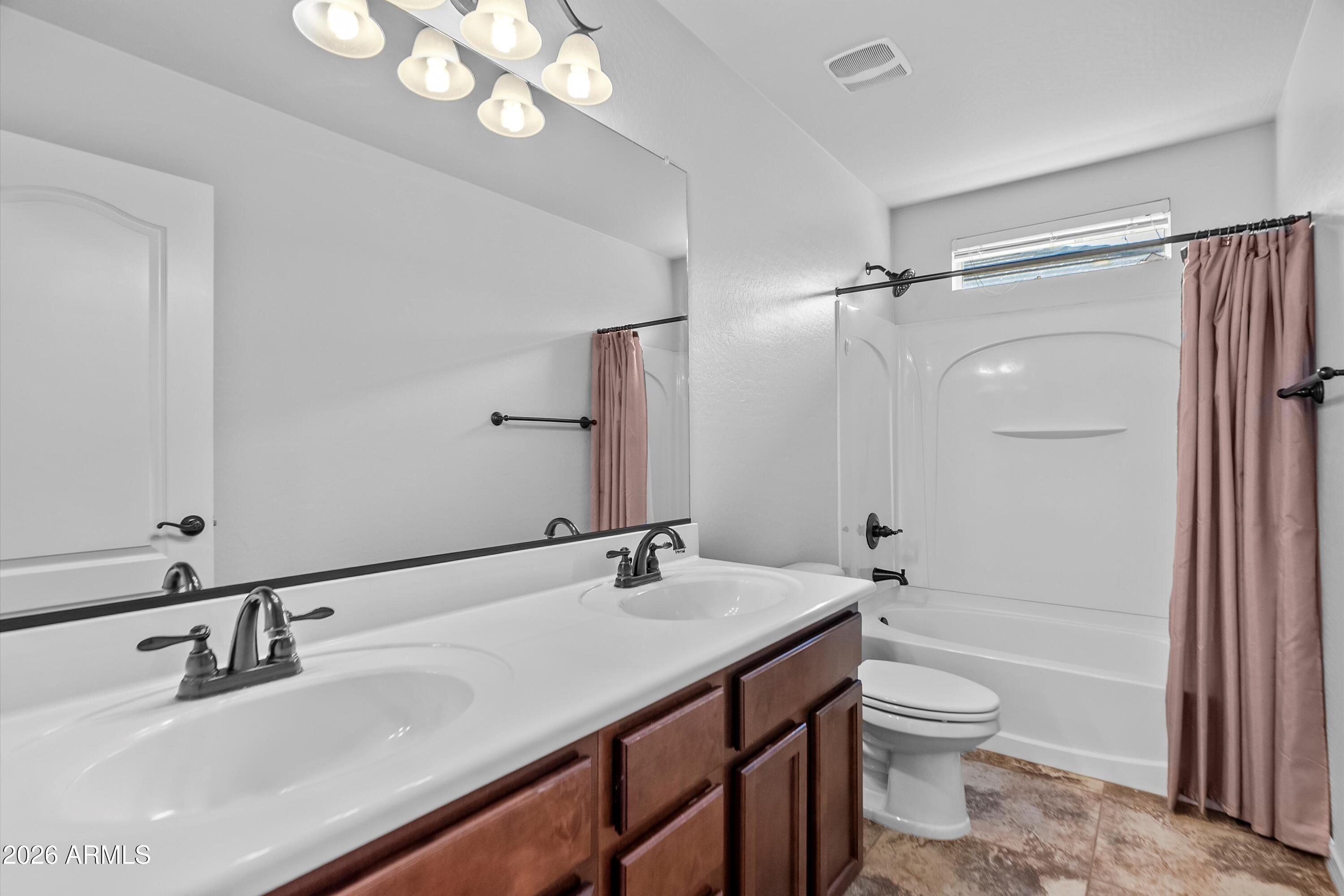 955 South Henry Lane Gilbert, AZ 85296 - Photo 29 of 40 a bathroom with a sink a toilet and shower