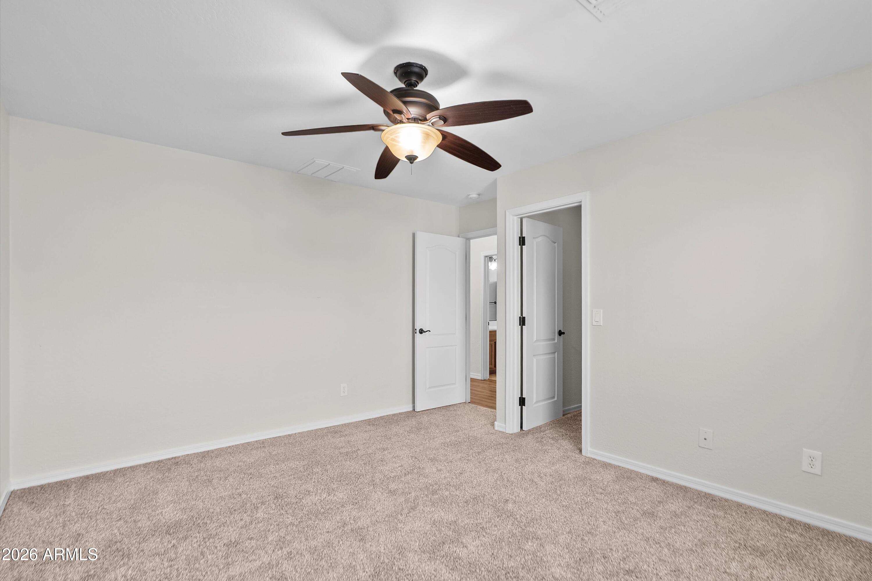 955 South Henry Lane Gilbert, AZ 85296 - Photo 31 of 40 a view of a room with a ceiling fan and a window