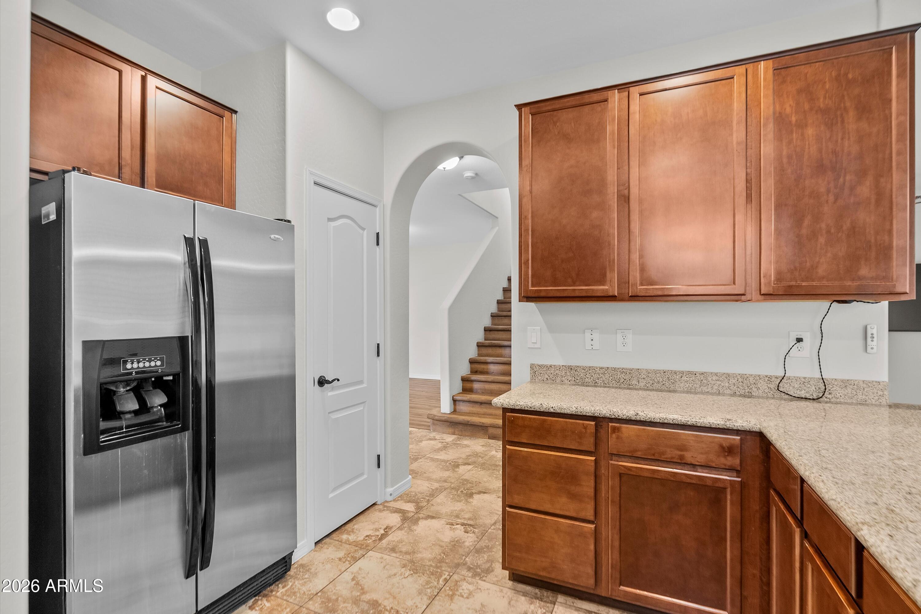 955 South Henry Lane Gilbert, AZ 85296 - Photo 4 of 40 a kitchen with a refrigerator sink and cabinets