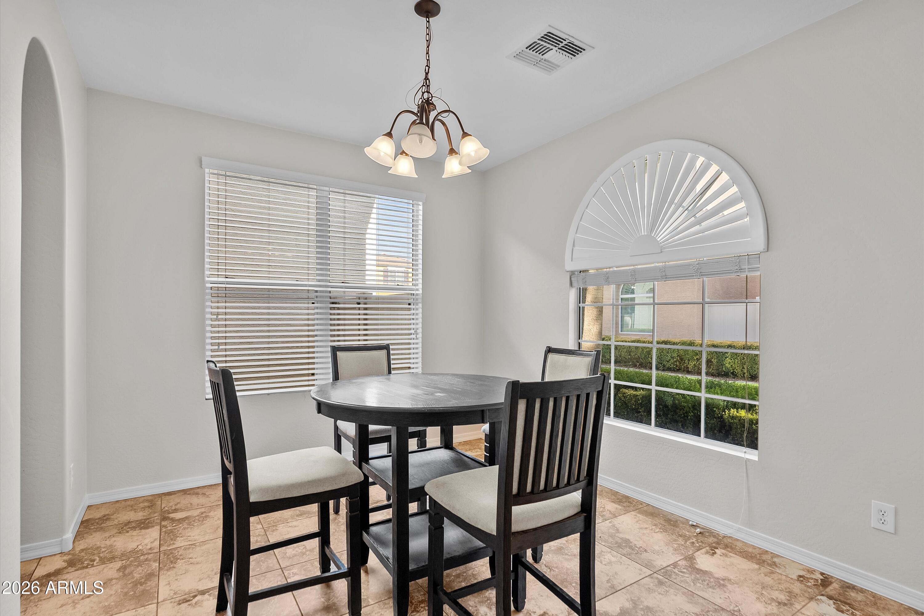 955 South Henry Lane Gilbert, AZ 85296 - Photo 7 of 40 a view of a dining room with furniture window and outside view