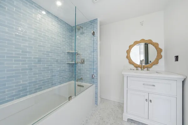 a dining room with furniture and a potted plant