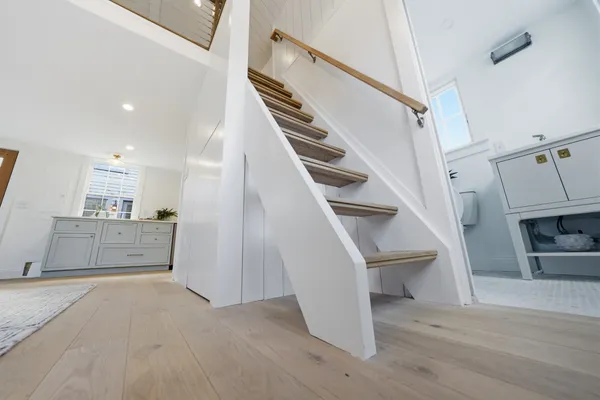 a large bedroom with a bed and dresser