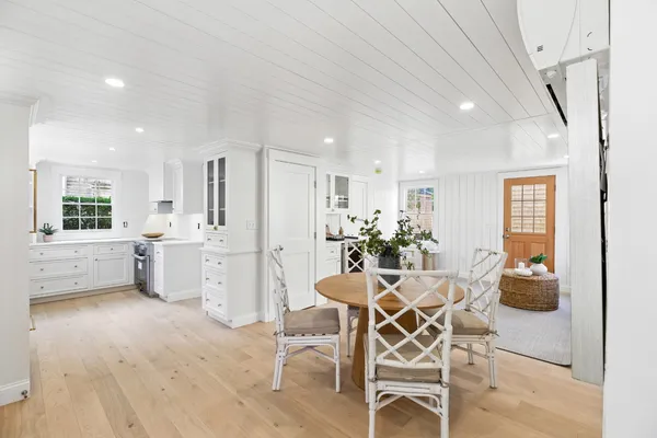 a dining room with furniture and window