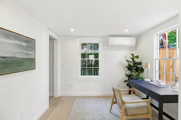 a workspace with furniture and window