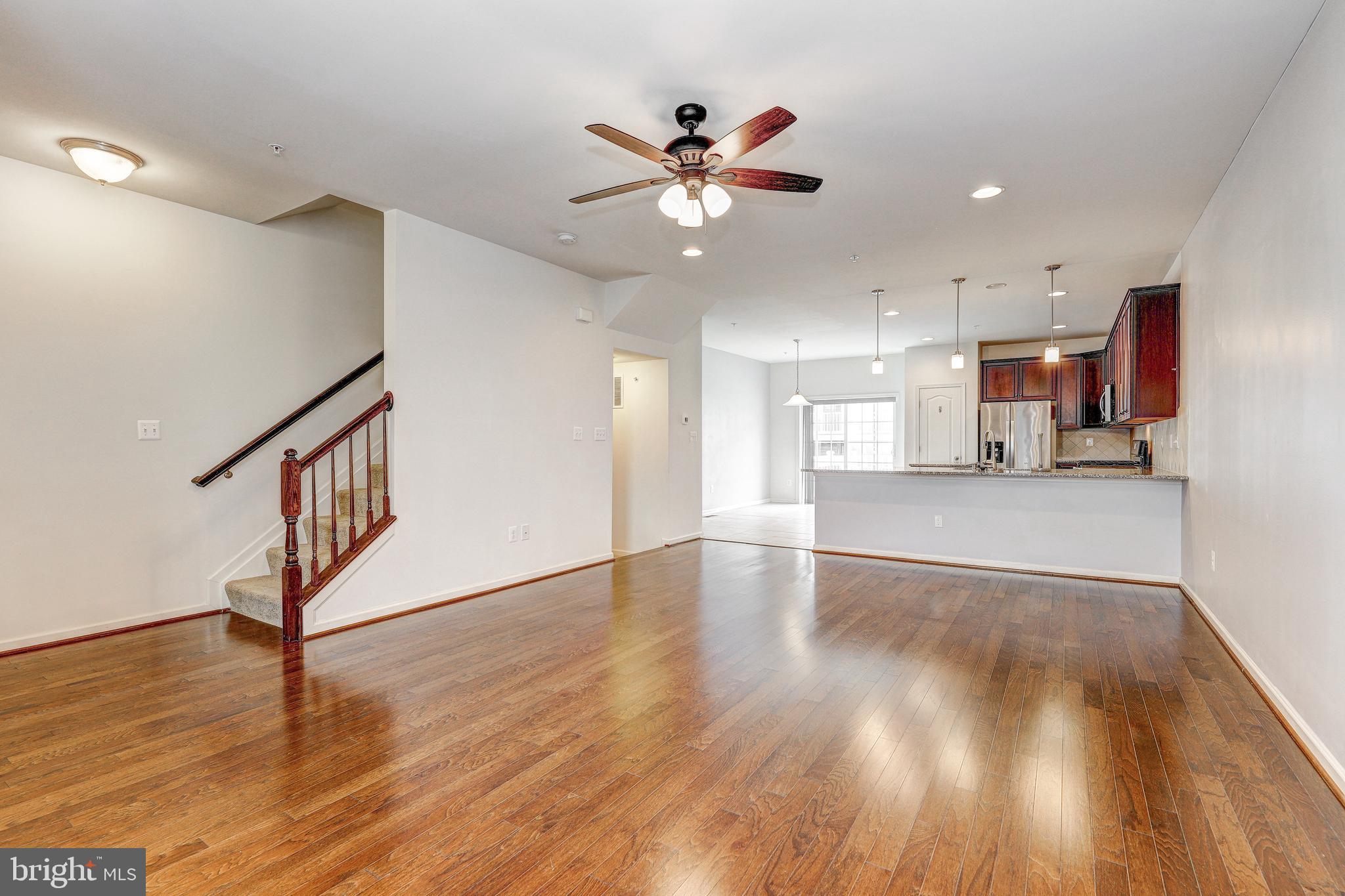912 Winter Run Road Middle River, MD 21220 - Photo 21 of 55 a view of an empty room with wooden floor and a ceiling fan