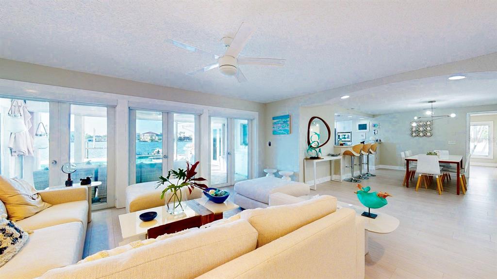 509 55th Avenue St. Pete Beach, FL 33706 - Photo 15 of 63 a living room with furniture and a large window