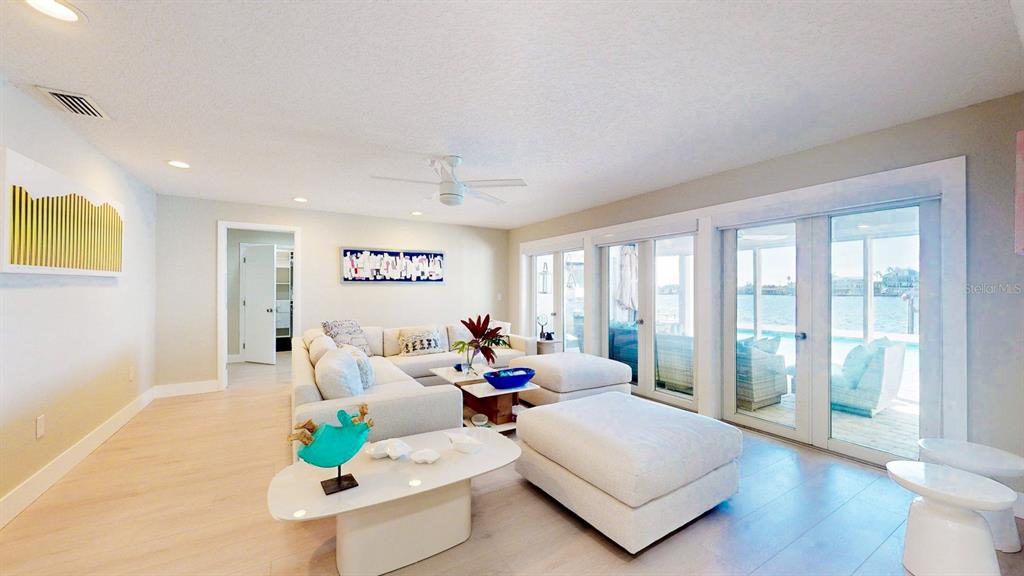 509 55th Avenue St. Pete Beach, FL 33706 - Photo 17 of 63 a living room with furniture and a large window
