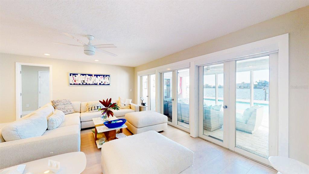 509 55th Avenue St. Pete Beach, FL 33706 - Photo 2 of 63 a living room with furniture and a large window