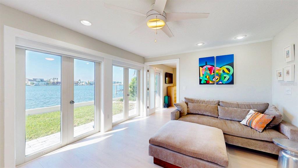 509 55th Avenue St. Pete Beach, FL 33706 - Photo 28 of 63 a living room with furniture and a large window