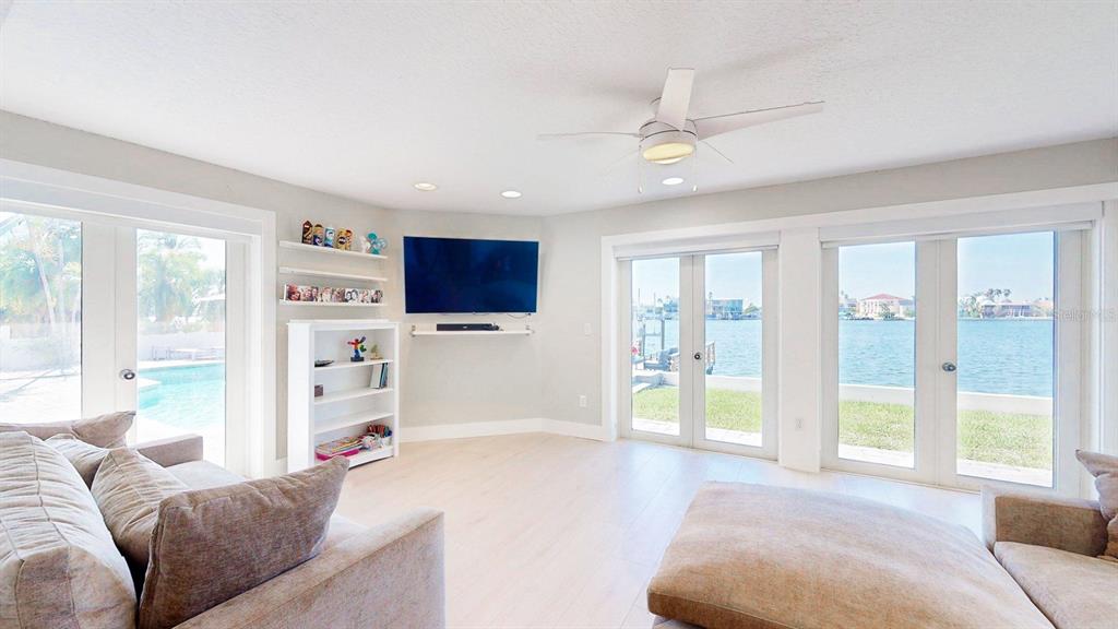509 55th Avenue St. Pete Beach, FL 33706 - Photo 29 of 63 a living room with furniture and a large window