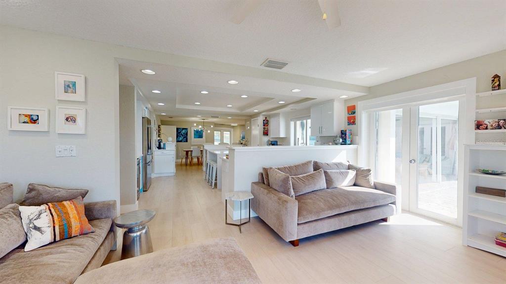 509 55th Avenue St. Pete Beach, FL 33706 - Photo 30 of 63 a living room with furniture and a couch