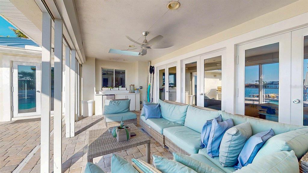 509 55th Avenue St. Pete Beach, FL 33706 - Photo 32 of 63 a living room with furniture or outdoor view and a large window