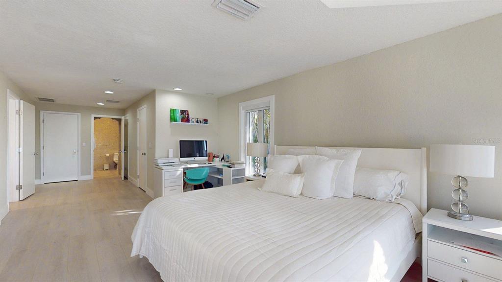 509 55th Avenue St. Pete Beach, FL 33706 - Photo 36 of 63 a bedroom with a bed and a flat screen tv