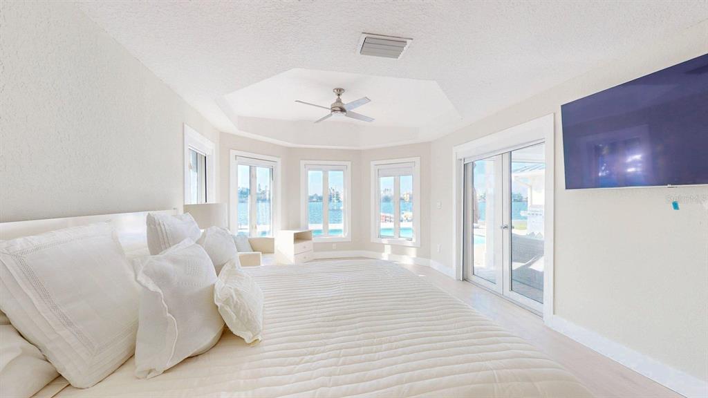 509 55th Avenue St. Pete Beach, FL 33706 - Photo 4 of 63 a living room with furniture and a floor to ceiling window