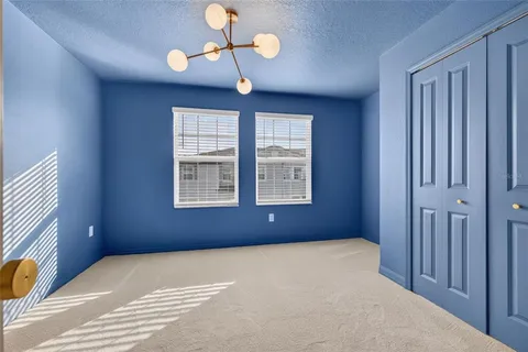 a view of an empty room with a bathroom