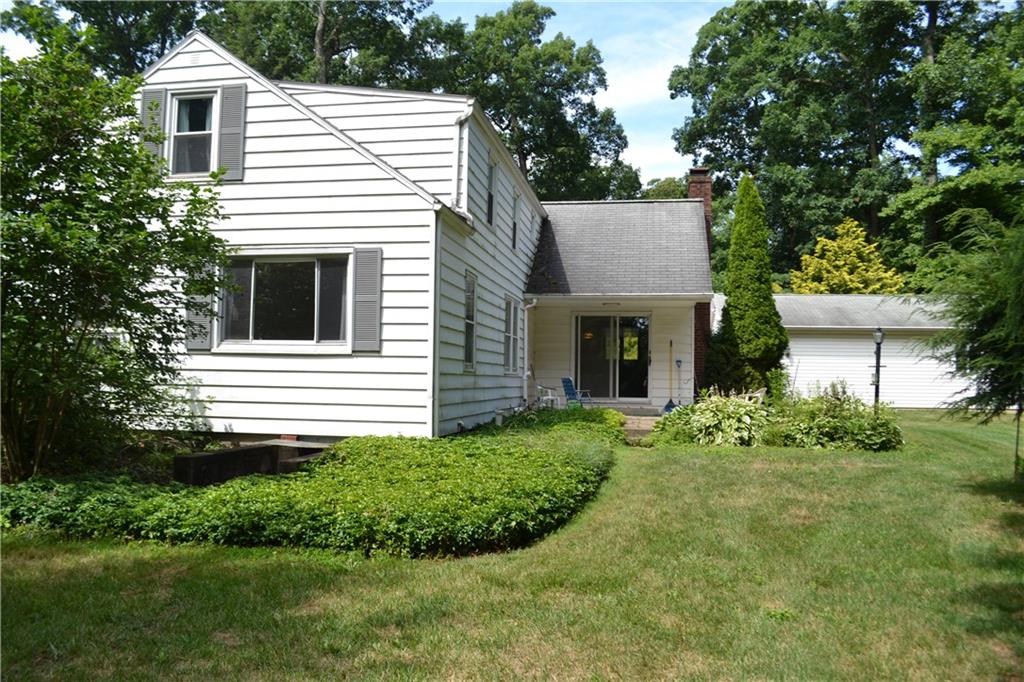 131 Weckerly Road Butler, PA 16002 - Photo 1 of 25 a front view of a house with a garden