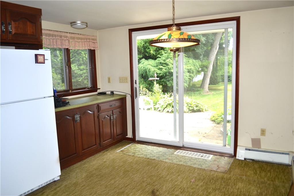 131 Weckerly Road Butler, PA 16002 - Photo 6 of 25 a view of a kitchen with a sink wooden floor and a refrigerator