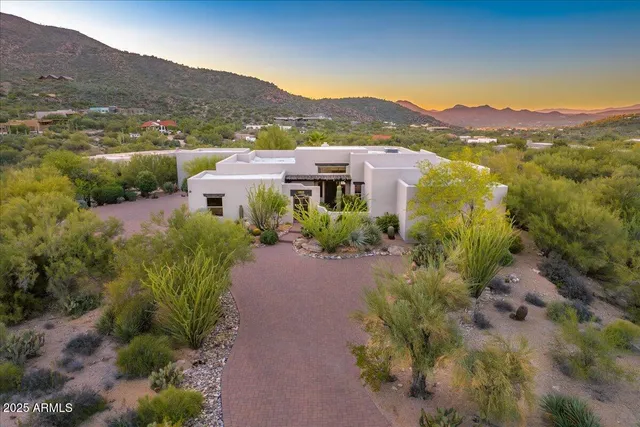 a view of a town with mountains in the background