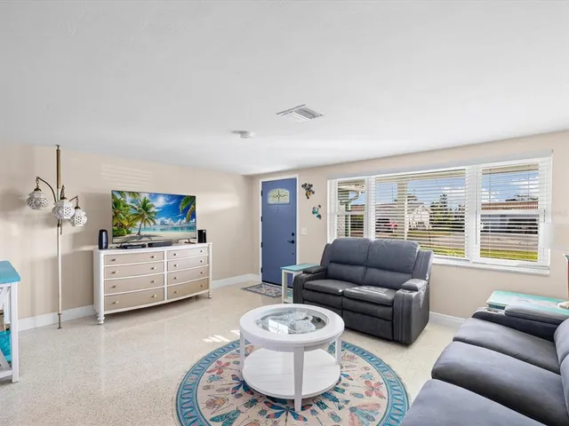 a view of a livingroom with furniture and cabinet