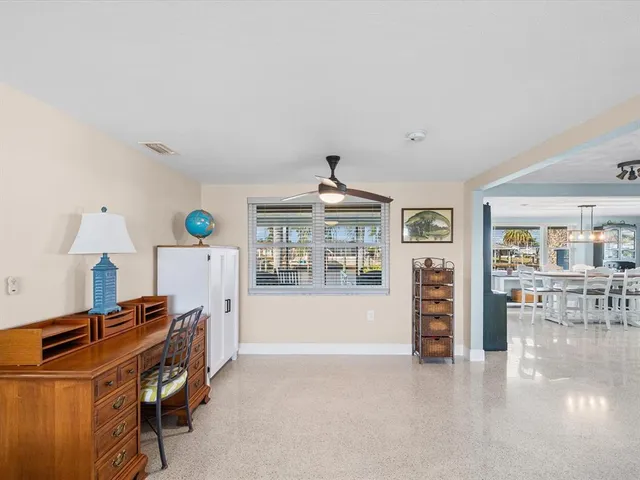 a view of room with a ceiling fan