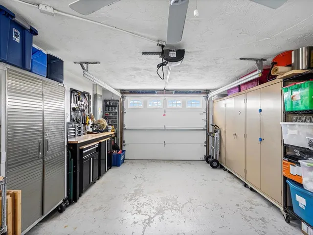a view of a balcony with dining table and a chandelier