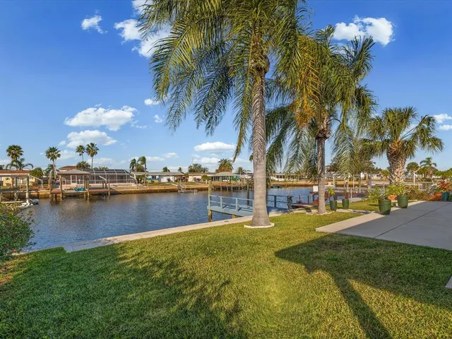 a view of a swimming pool with a table and chairs