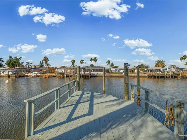 an aerial view of a house with outdoor seating swimming pool and outdoor space