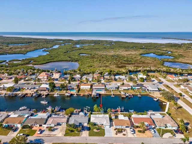 an aerial view of residential building and ocean