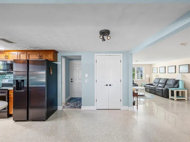 a view of a dining room with furniture and window