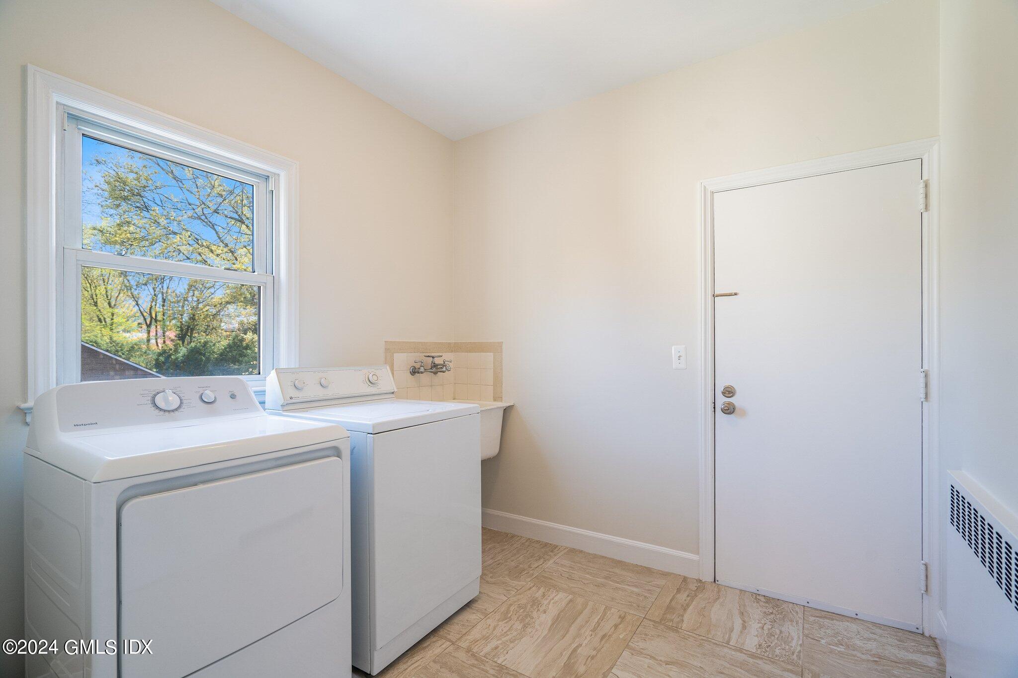 14 Byram Shore Road, Unit 1 Greenwich, CT 06830 - Photo 13 of 19 a utility room with dryer and washer