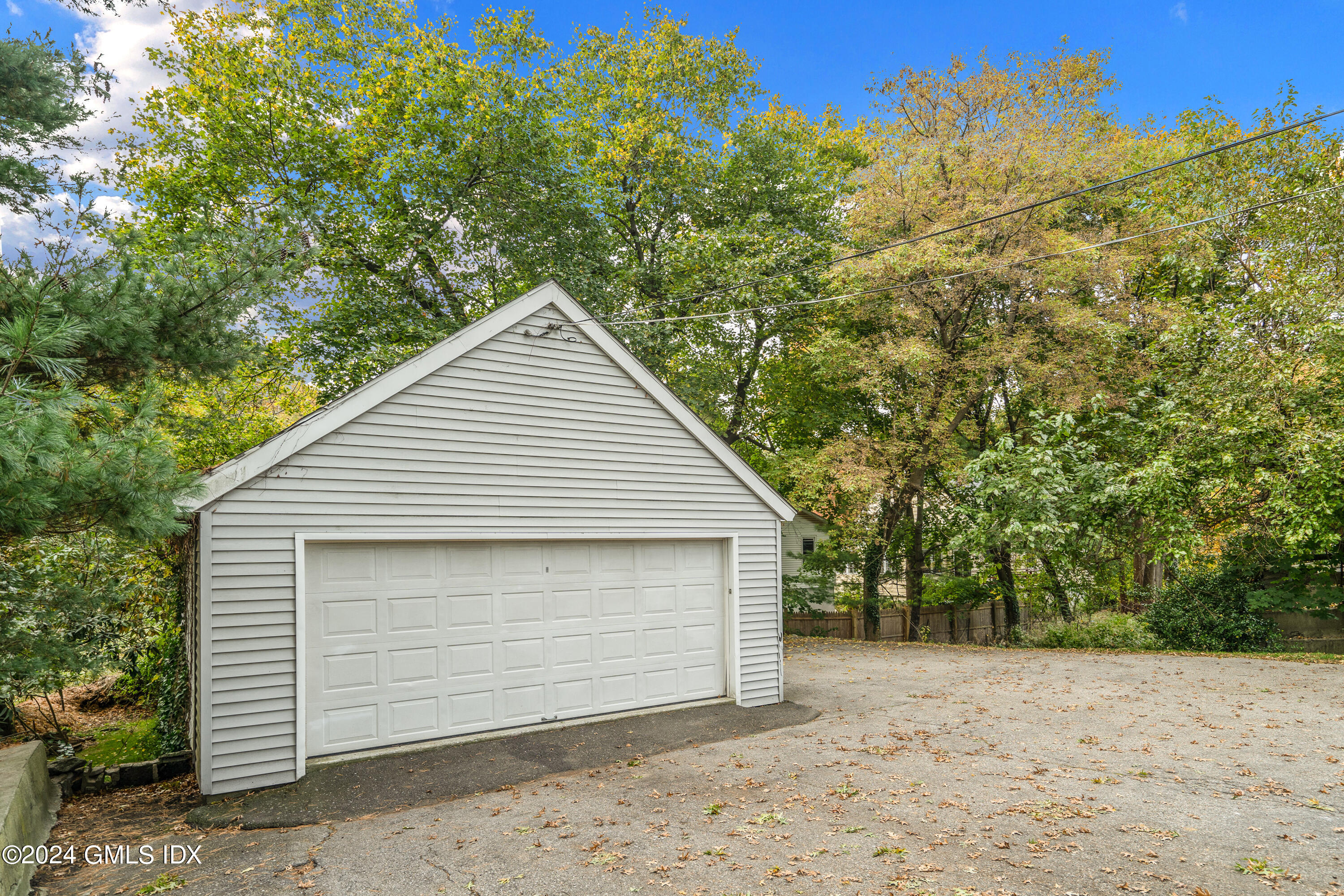 14 Byram Shore Road, Unit 1 Greenwich, CT 06830 - Photo 15 of 19 a view of a small house with a yard