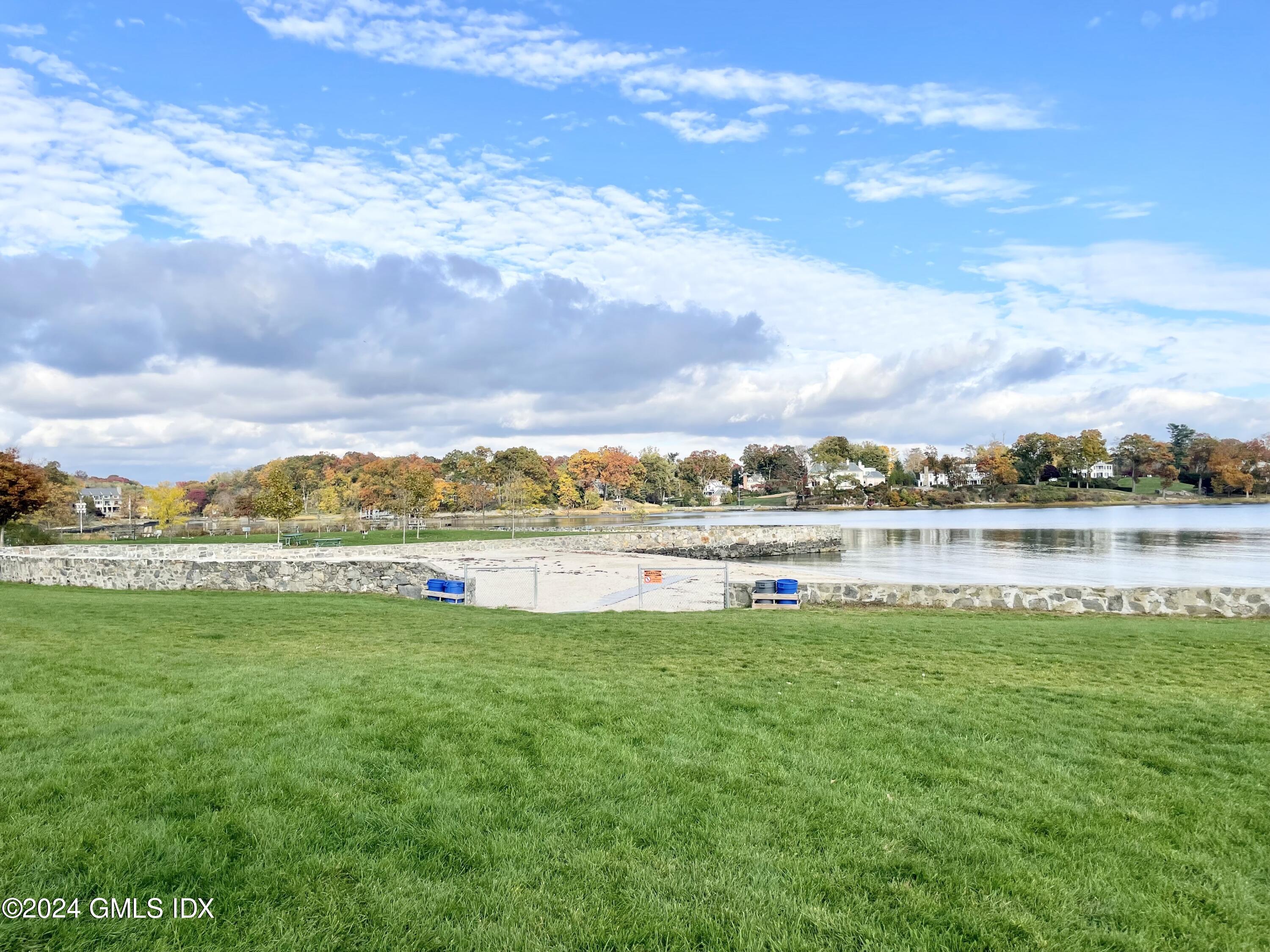 14 Byram Shore Road, Unit 1 Greenwich, CT 06830 - Photo 19 of 19 a view of a lake with a beach