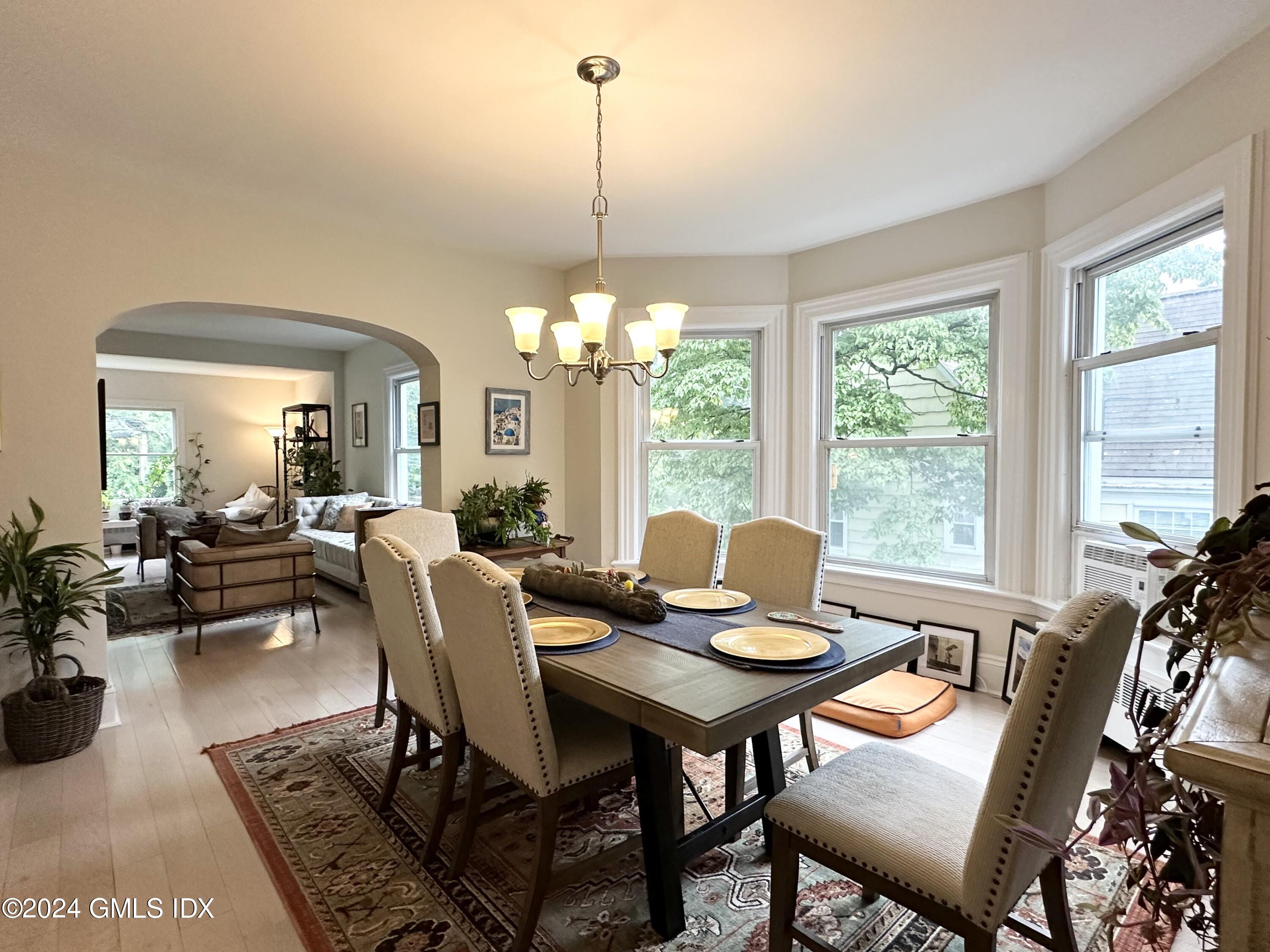 14 Byram Shore Road, Unit 1 Greenwich, CT 06830 - Photo 5 of 19 a view of a dining room with furniture window and outside view
