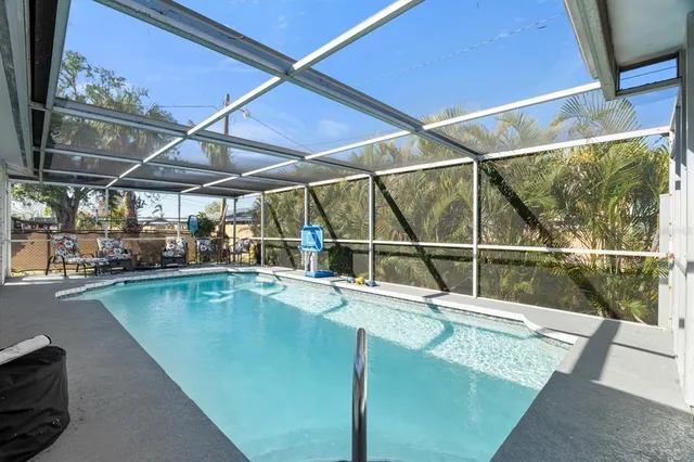 a view of a swimming pool with a patio