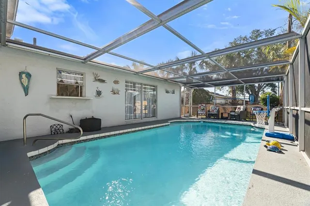 a view of a swimming pool with a patio