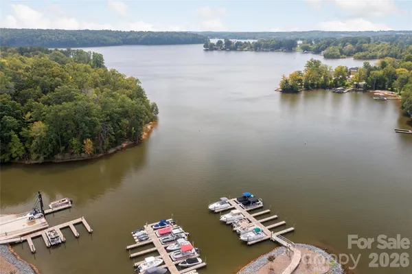 a view of a ocean with residential house and ocean view