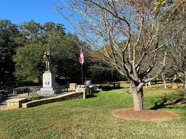 a garden view with a fountain