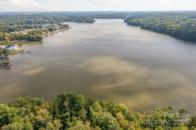 an aerial view of lake and mountain