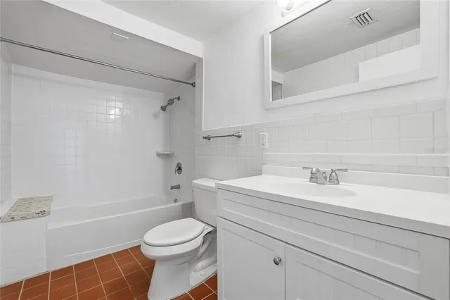 a bathroom with a sink a toilet and a bathtub