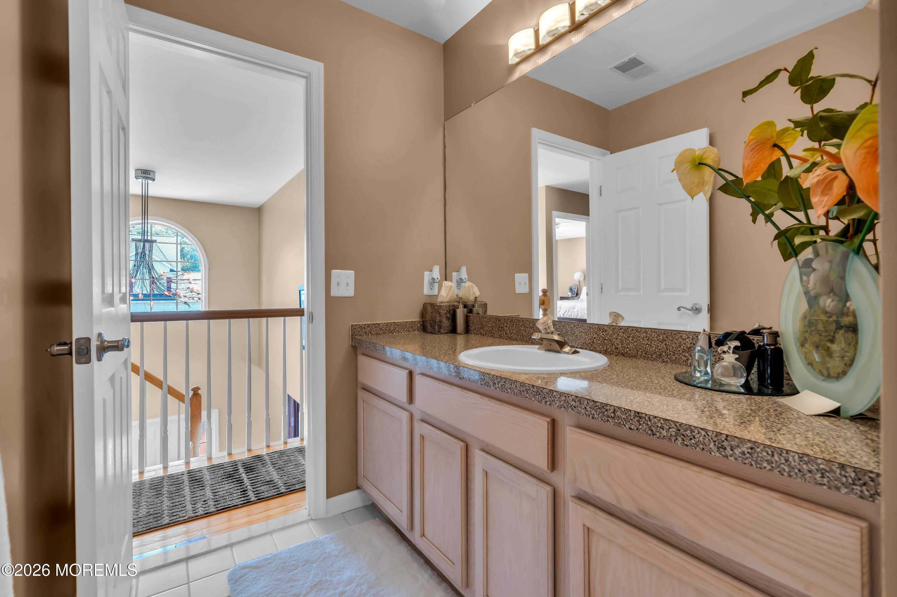 10 Beacon Place Old Bridge, NJ 08857 - Photo 39 of 72 a bathroom with a granite countertop sink and a mirror