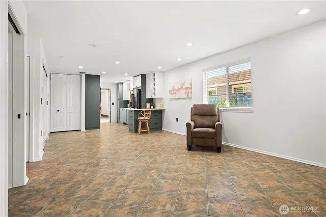 a living room with furniture and a large window