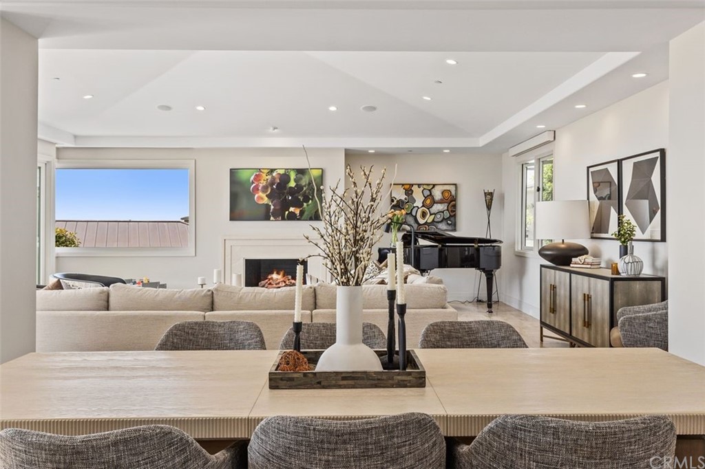 846 Emerald Bay Laguna Beach, CA 92651 - Photo 11 of 42 a living room with fireplace furniture rug and window