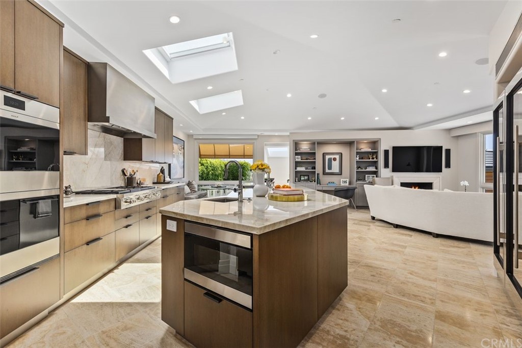 846 Emerald Bay Laguna Beach, CA 92651 - Photo 16 of 42 a kitchen with stainless steel appliances granite countertop a stove and a sink