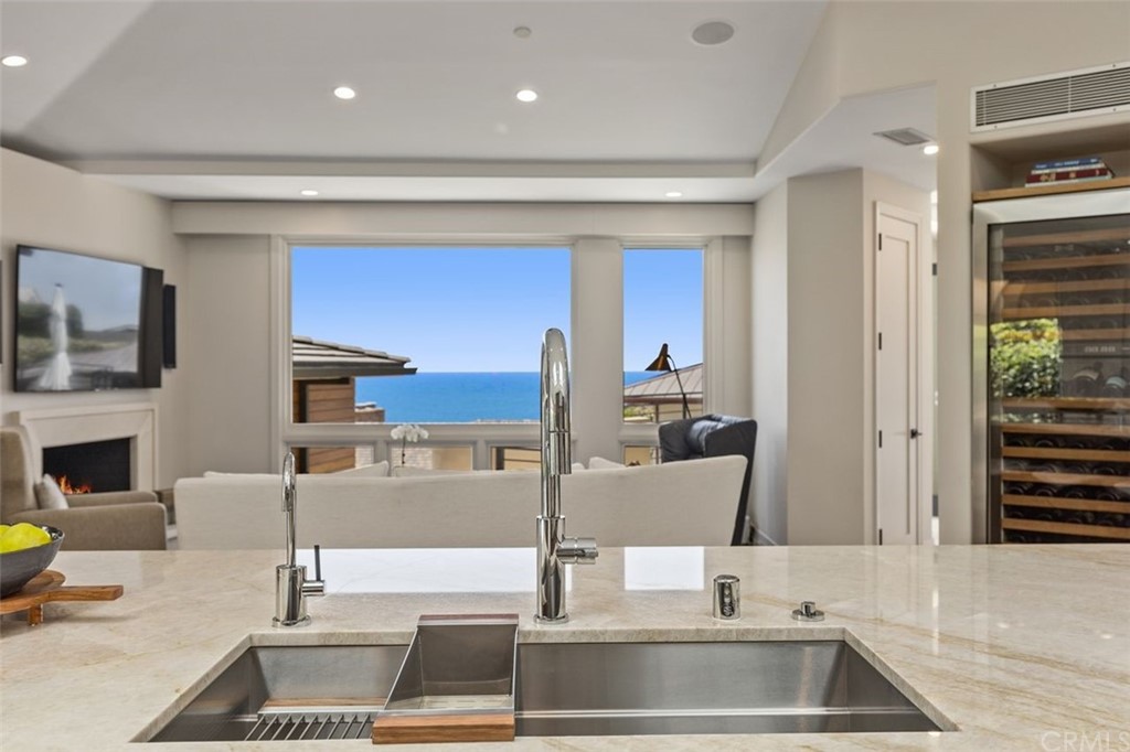 846 Emerald Bay Laguna Beach, CA 92651 - Photo 20 of 42 a kitchen with a sink and a refrigerator