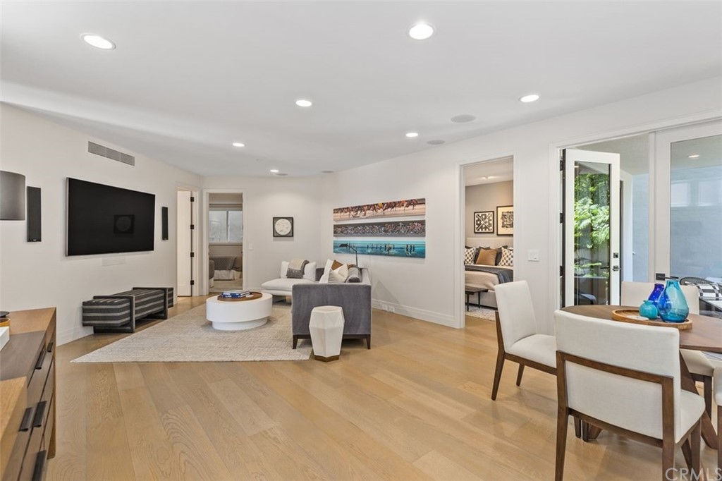 846 Emerald Bay Laguna Beach, CA 92651 - Photo 30 of 42 a living room with furniture and a flat screen tv