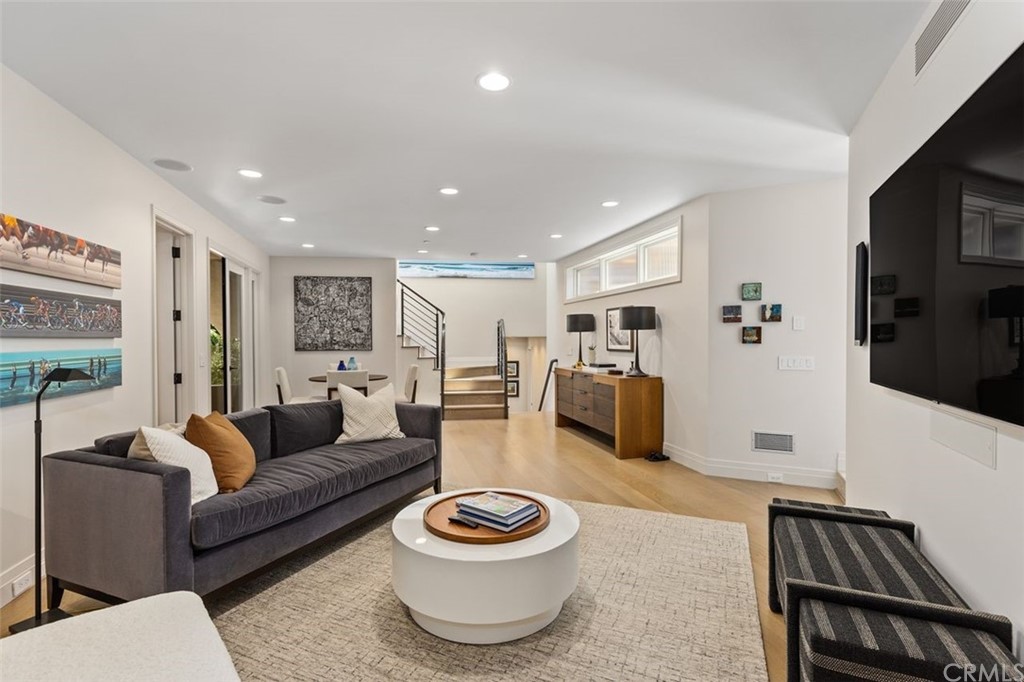 846 Emerald Bay Laguna Beach, CA 92651 - Photo 31 of 42 a living room with furniture and a flat screen tv