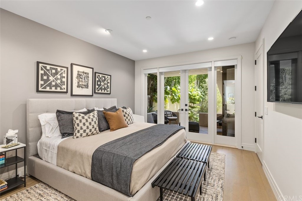 846 Emerald Bay Laguna Beach, CA 92651 - Photo 34 of 42 a bedroom with a large bed and a large window